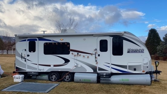 travel trailer with rv skirts in summer
